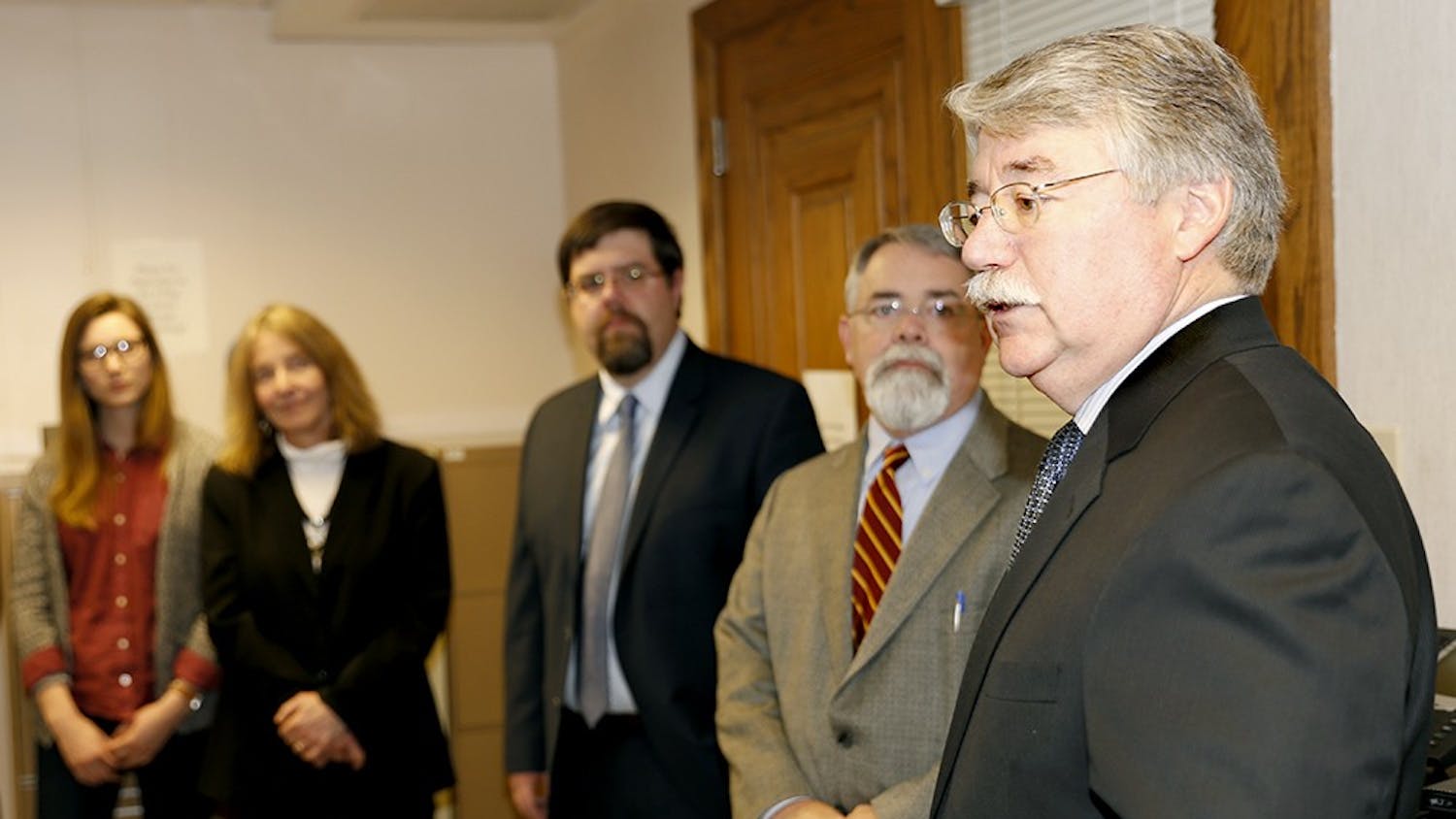 Indiana Attorney General Greg Zoeller, left, speaks to members of Indiana Legal Services, Inc. Thursday at the Indiana Legal Services, Inc. building. 
