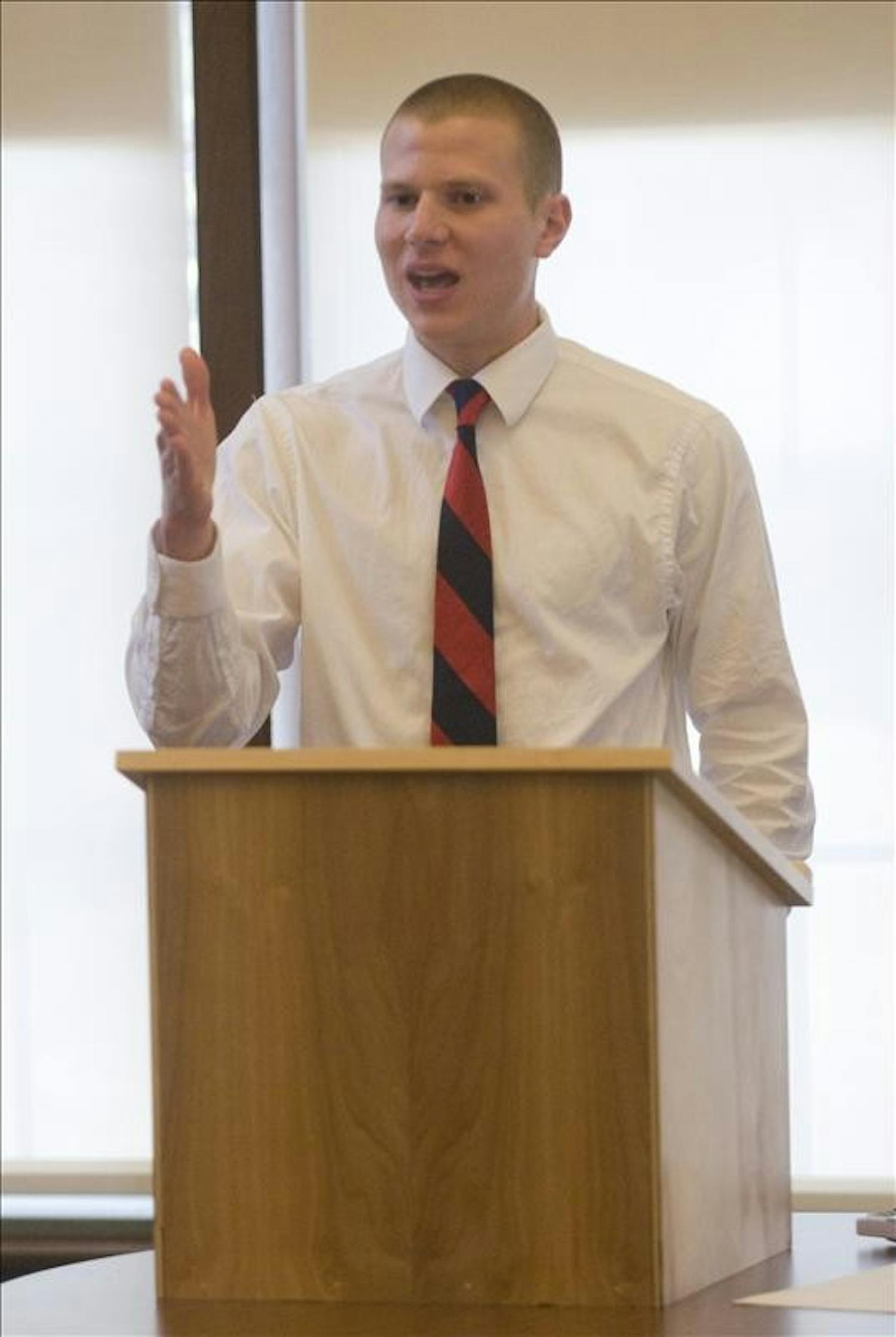 DePauw University student Michael Lutz makes a response during the final debate of the Intervarsity Lincoln-Douglas Debate Competition Sunday afternoon at the Hutton Honors College. The debates were judged by city council members and IU professors and graduate students. 