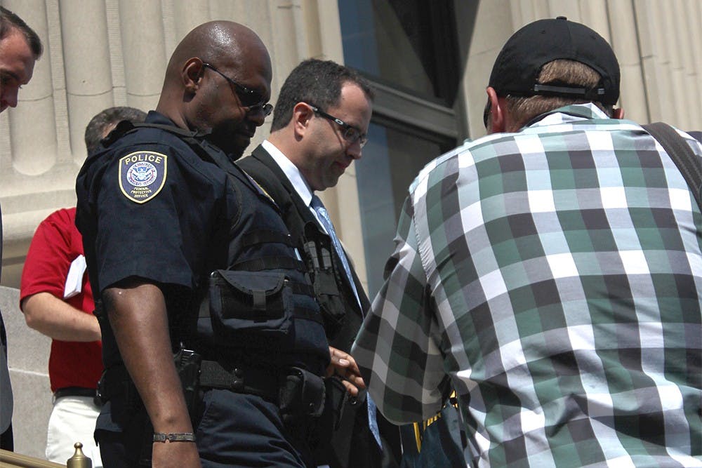 Jared Fogle leaves the federal courthouse in Indianapolis after his hearing on Wednesday. Fogle plead guilty to charges of distributing child pornography and paying for and engaging in sex acts with minors.