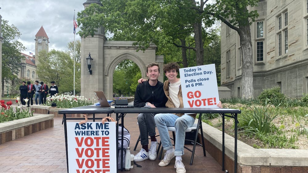 IU students Tim Dwyer (left) and Emmett Nolan (right) table ﻿at the Sample Gates on behalf of the College Democrats at IU for Election Day. Former IU student Sydney Zulich won the Democratic nomination for the Bloomington City Council District 6 race. 