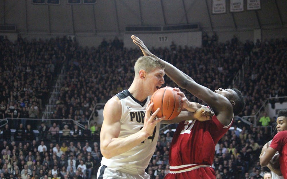 IU sophomore center Thomas Bryant falls down after being elbowed in the face during the game against Purdue on Tuesday evening. Bryant fouled out of the game with eight points.