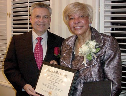 COURTESY PHOTOGerardo Gonzalez, dean of the IU School of Education, presents 1968 Alumna Dorothy Hawkins-Brooks with a replacement diploma after the original one was lost during Hurricane Katrina.