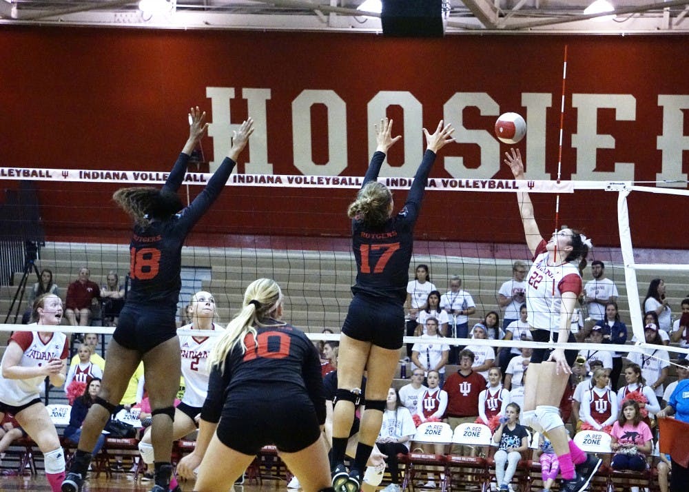 Freshman outside hitter Kamryn Malloy tips the ball over for a point against the Rutgers Scarlet Knights on Oct. 20 during a Big Ten match. IU finished the 2017 season 1-19 in conference play.