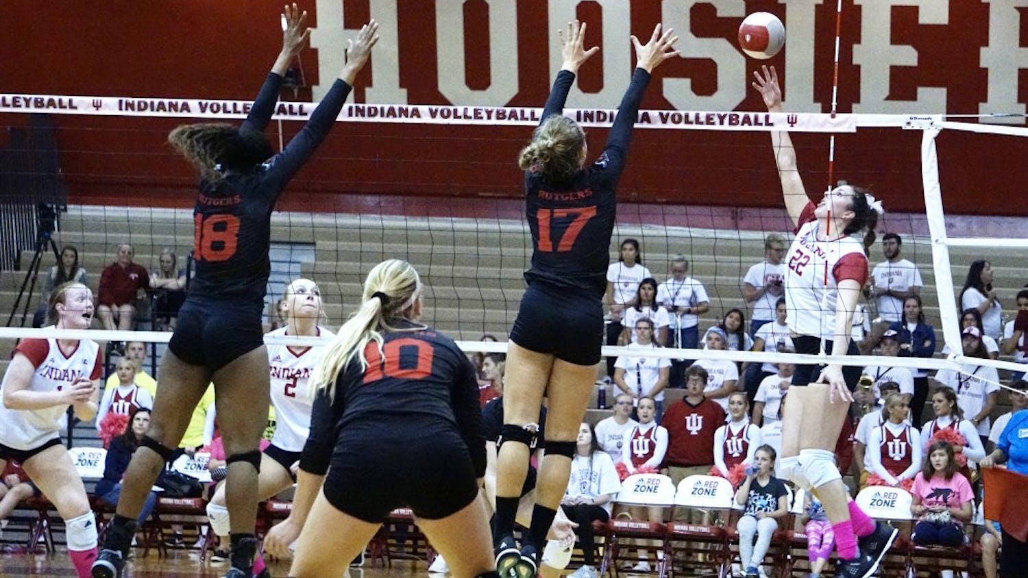 Freshman outside hitter Kamryn Malloy tips the ball over for a point against the Rutgers Scarlet Knights on Oct. 20 during a Big Ten match. IU finished the 2017 season 1-19 in conference play.