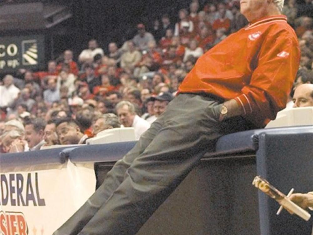 Indiana coach Bob Knight leans back on the scores bench as Indiana turned over the ball to Holy Cross late in the second half of the championship game of the Hoosier Classic in Indianapolis Tuesday, Dec. 28, 1999. 