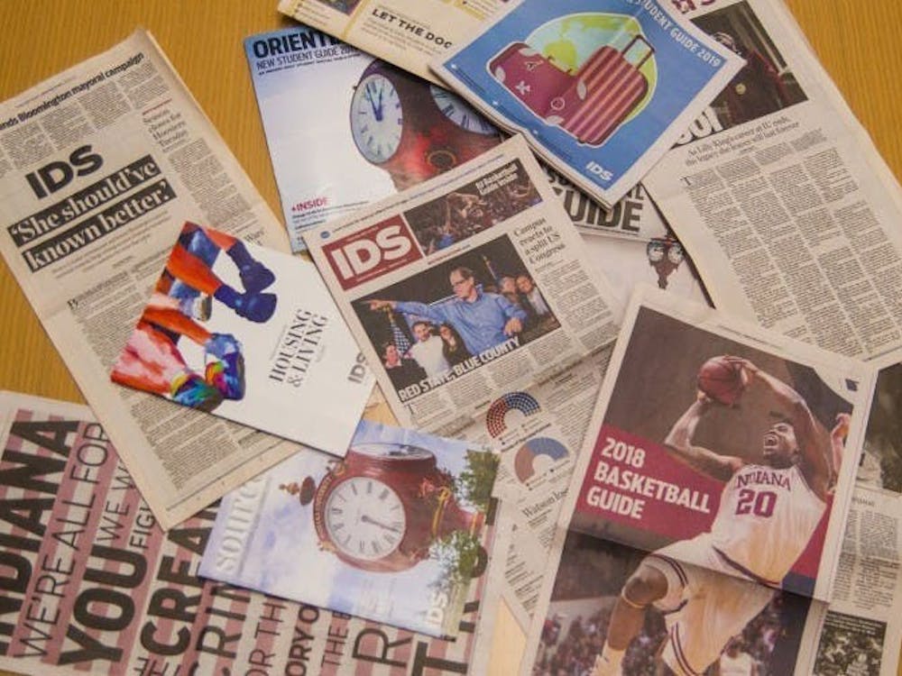 A collection of Indiana Daily Student publications lie on a table. The print edition of the paper will be published once per week this fall.