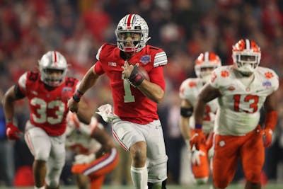 Then-junior quarterback Justin Fields from Ohio State scrambles with the football during the PlayStation Fiesta Bowl against Clemson University on Dec. 28, 2019 at State Farm Stadium in Glendale, Arizona. Fields has started a movement asking the Big Ten to reverse its decision to postpone the fall football season.