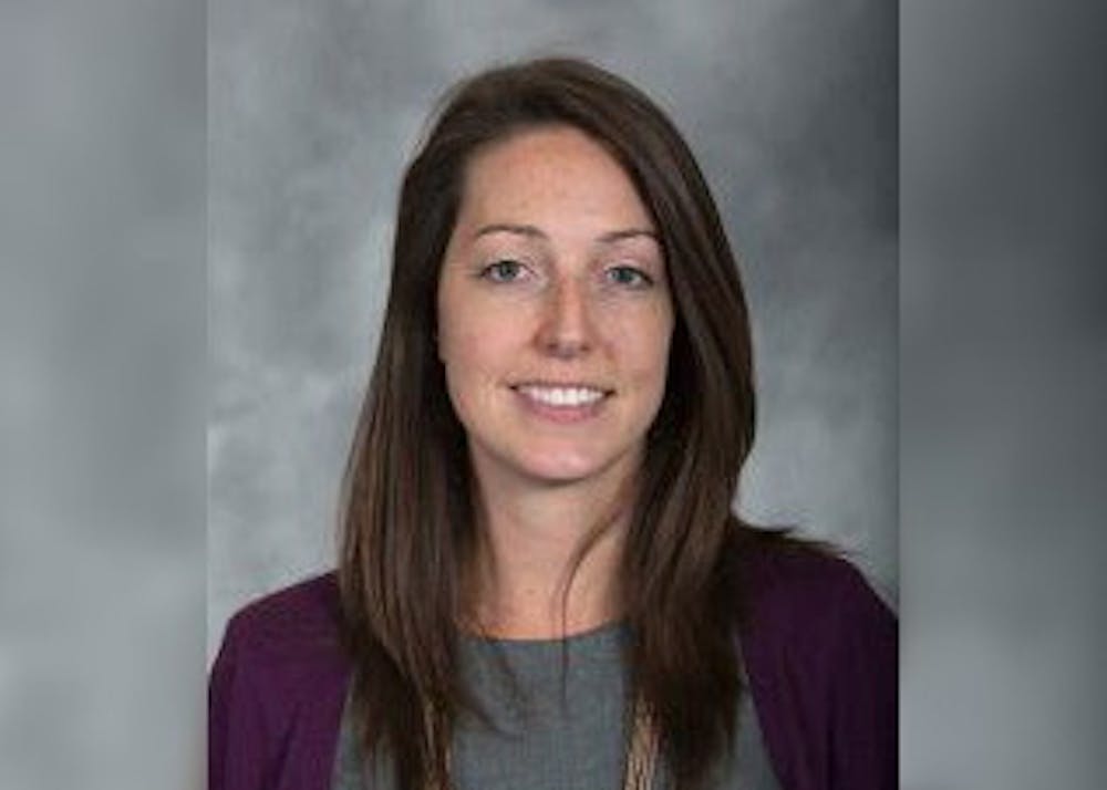 <p>Dr. Caitlin Bernard, an IU Health OB-GYN and assistant professor at the IU School of Medicine, smiles for a portrait. The Indiana Medical Licensing Board found Bernard, an IU Health OB-GYN who provided abortion care to a 10-year-old girl from Ohio in July 2022, violated state and federal privacy laws in a hearing Thursday.<br/><br/></p>