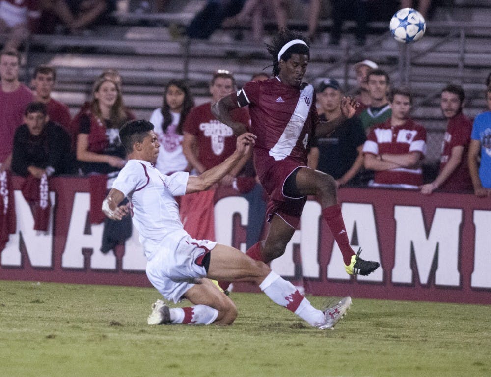 Senior Femi Hollinger-Janzen evades a tackle from a St John's defender during IU's 1-0 win Friday at Bill Armstrong Stadium