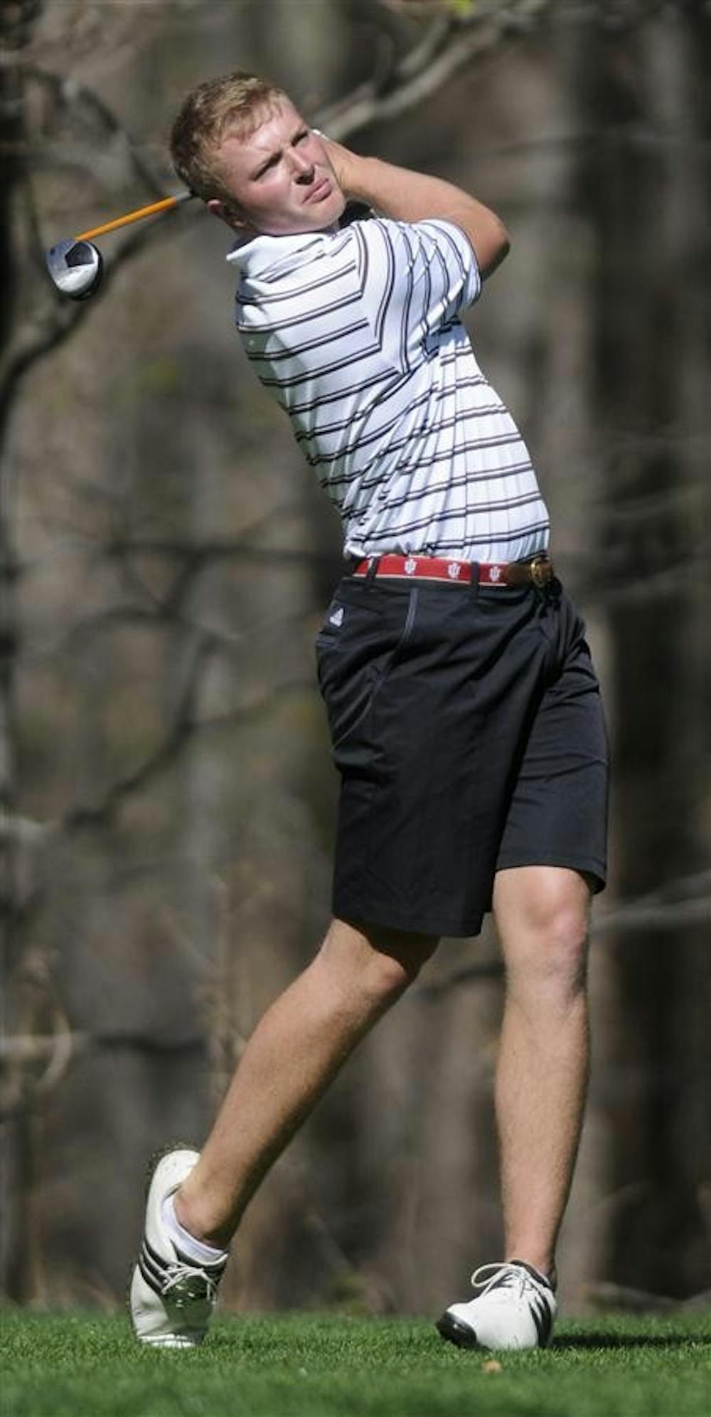 Then-junior David Erdy watches his shot from the ninth tee during the adidas Hoosier Invitational on April 9, 2011, at the IU Golf Course. The men's golf team has their first competition this weekend in Bradenton, Fla.
