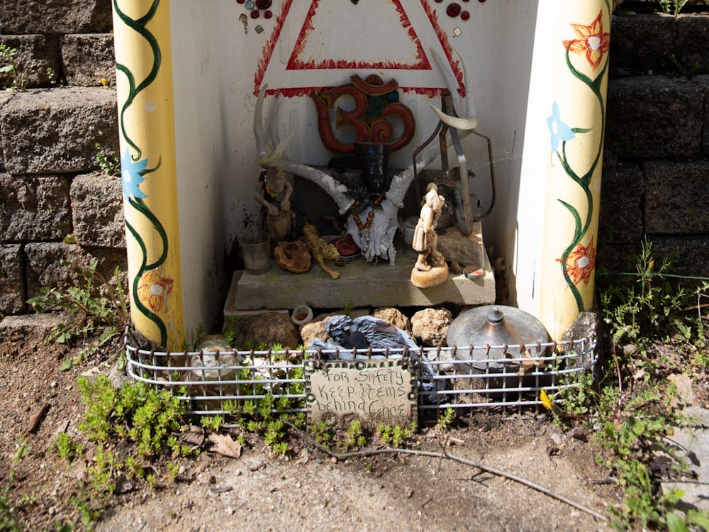 A small shrine full of rocks, candles and figurines sits inside the dome-covered Thunder Shrine at Lothlorien Nature Sanctuary on May 1, 2022. The dome includes four shrines, each representing one of the four elements.