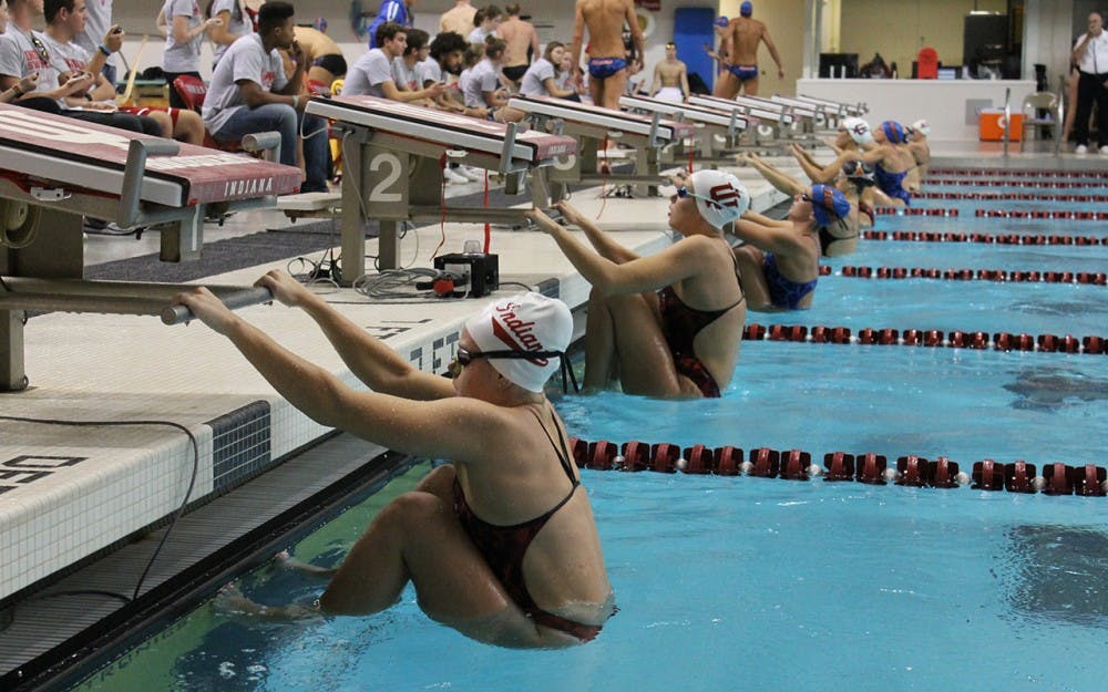 Indiana, Texas and Florida swimmers prepare to race. IU hosted the Florida Gators and Texas Longhorns for a swimming and diving meet on Friday and Saturday.
