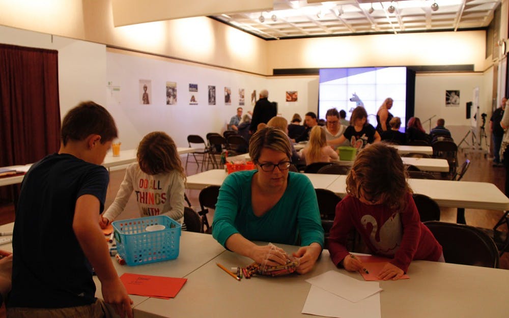Julie Warren and daughter Remi made their mystery notebooks Sunday afternoon as part of the "Mystery at the Museum" event at the Mathers Museum of World Cultures.