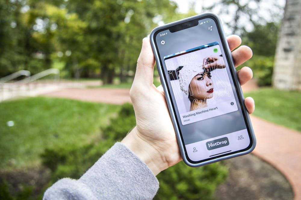 <p>The HotDrop app is seen on a phone Oct. 12, 2021, outside of Franklin Hall. Two IU juniors launched the new app Sept. 29, 2021, to help users discover and share songs with friends.</p>
