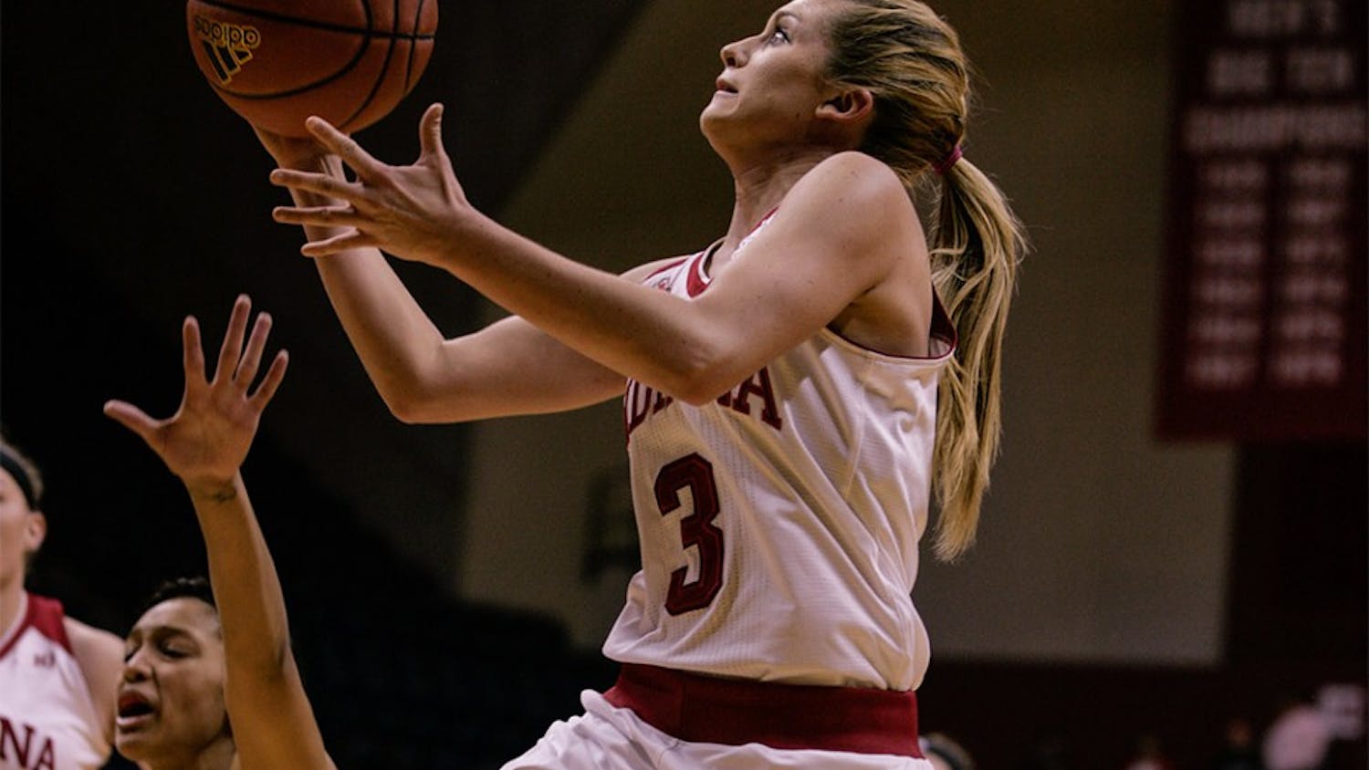Sophomore guard Tyra Buss goes up to the basket to attempt a layup against Wisconsin. Buss scored 24 points against the Badgers, leading the Hoosiers to a 67-57 victory Sunday at Assembly Hall. 