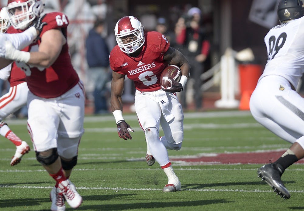 Junior running back Tevin Coleman runs the ball during IU's game against Purdue on Saturday at Memorial Stadium. Coleman surpassed 2,000 yards rushing on the season during the Hoosiers' final game of the year.