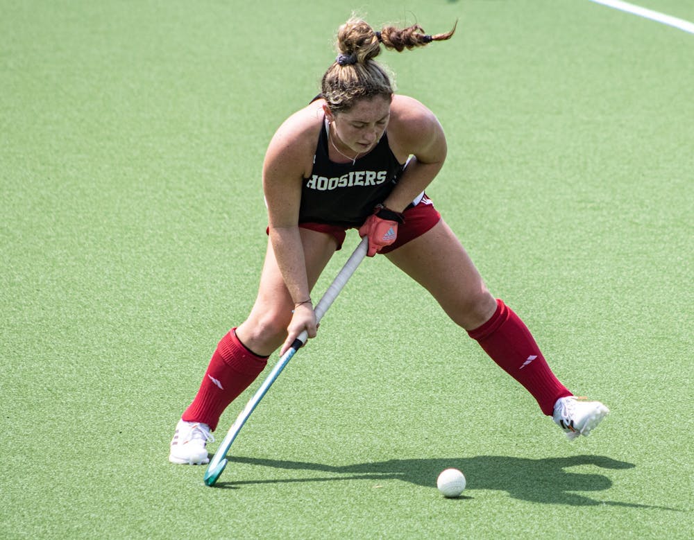 <p>Senior Jes McGivern moves to pass the ball during the Cream/Crimson Scrimmage on Aug. 22, 2021, at the IU field hockey Complex. Miami University lost its first two games this season.</p>