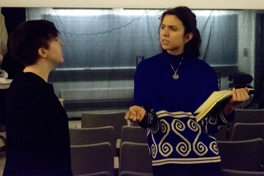 Kayla Tillisch, right , director of the Vagina Monologues, guides the role of Heather Wesner during a rehearsal of the play on Wednesday at Woodburn Hall. The Vagina Monologues will be played on Feb 12-14 at Woodburn Hall Room 100. 