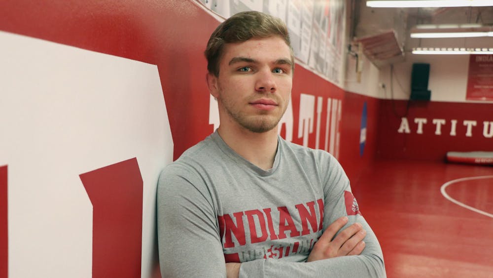 Then-junior Brock Hudkins stands for a headshot in the wrestling practice room in Simon Skjodt Assembly Hall. Hudkins was ranked No. 6 in the 125-pound class by Open Mat last week.
