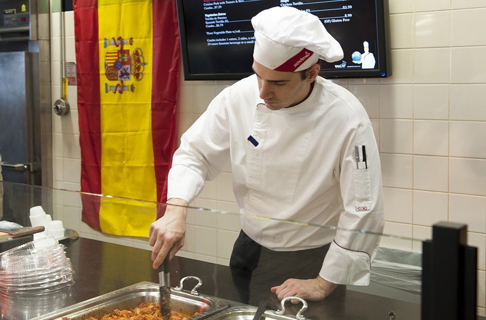 Spanish chef Jose Miguel Exposito waching over the food he prepared at the IMU food court. Exposito will be at IU on March 2 and 3 as part of the Global Chef Program with SODExO, the company that provides food services at IU's IMU. Exposito wil lalso be holding a cooking demonstration at on March 3. 