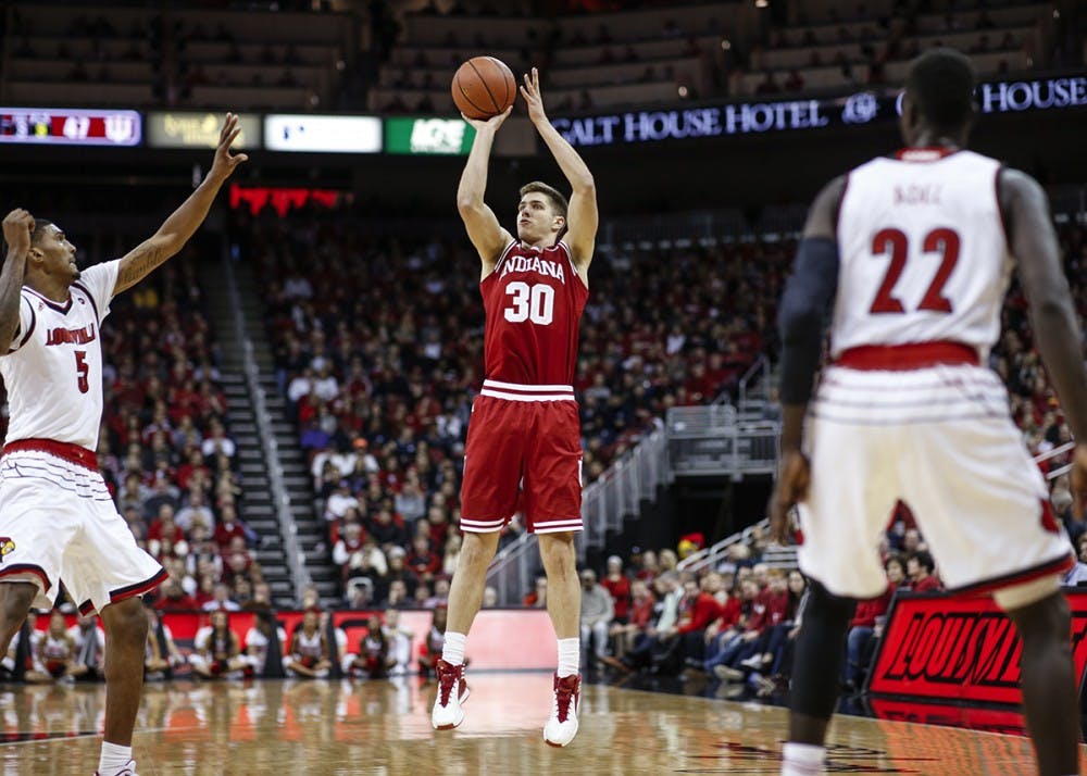 Senior forward Collin Hartman attempts a shot during the Hoosiers' game against the Louisville Cardinals on Saturday at the KFC Yum! Center in Louisville, Kentucky. The Hoosiers fell to the Cardinals, 71-62.