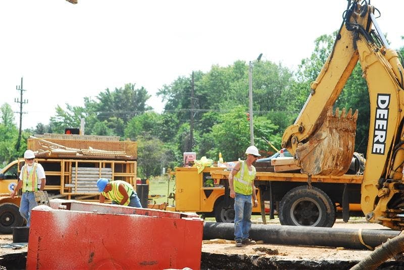 City of Bloomington utility employees work to fix the broken water main at 10th Street and the 45/46 bypass on Wednesday afternoon.