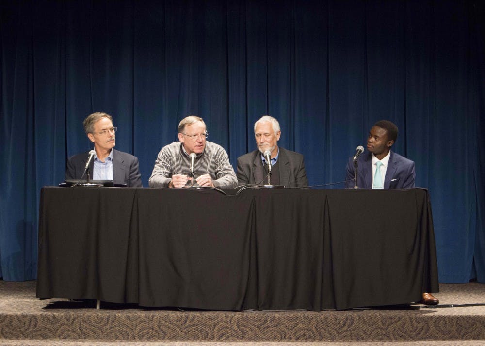 Panel members met to discuss climate change on Thursday evening in the Whittenberger Auditorium. Jeffrey White, second from the left and a professor and researcher of climate change, was the first to speak.&nbsp;
