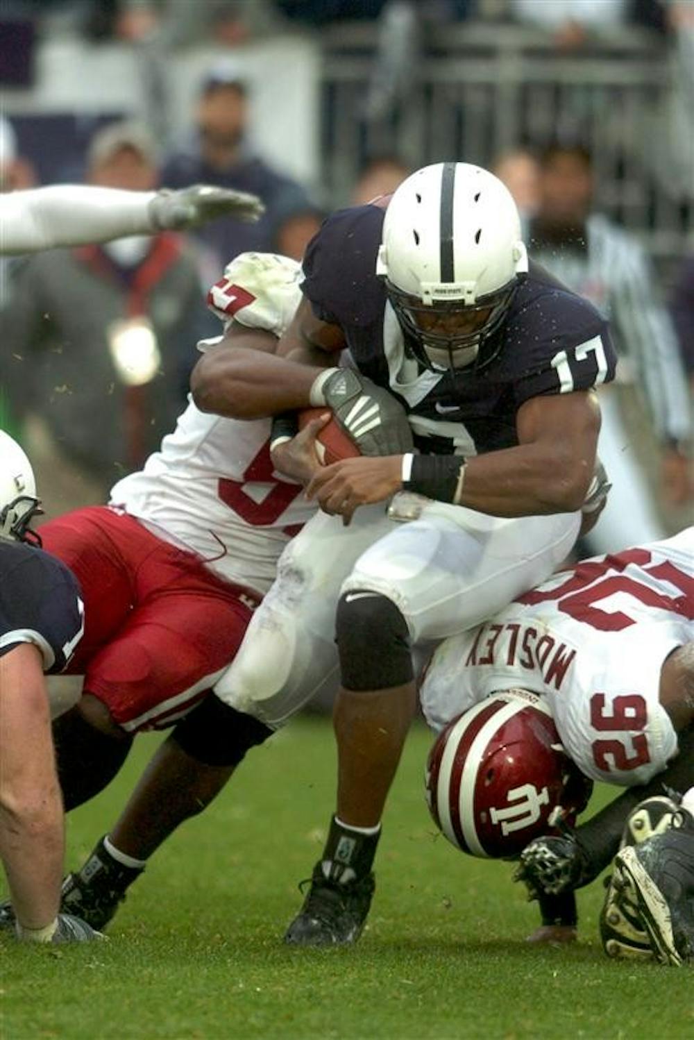 Penn State's Daryll Clark gets tackled by two IU defenders during the Nittany Lions' win over IU Saturday.