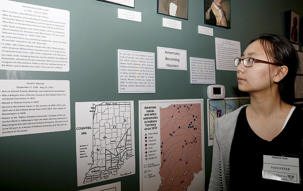 Helena Han, volunteer shows "Timeline for Statehood" exhibits Saturday at the Monroe County History Center. The center displayed various exhibitions highlighting the lives of Hoosiers under three themes: Starvation, Struggle and Statehood. 