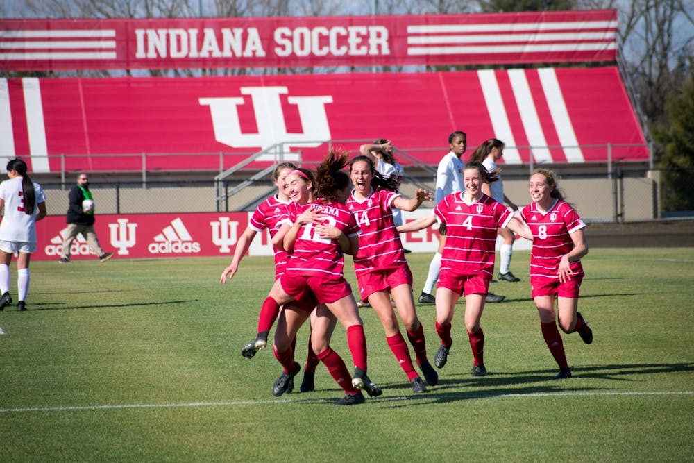 <p>Players on the Indiana women&#x27;s soccer team celebrate Feb. 25, 2021, at Bill Armstrong Stadium. Indiana will face the Univeristy of Notre Dame on Sunday in Bloomington.</p>