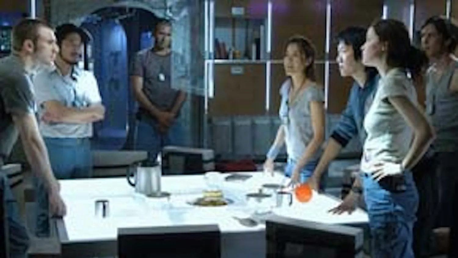 The multicultural crew members of Icarus II observes a scientific examination of their hammy acting.