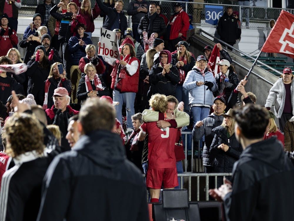 Sophomore forward Samuel Sarver embraces a fan after Indiana&#x27;s win against Pittsburgh December 9, 2022, at WakeMed Soccer Park in Cary, North Carolina. The Hoosiers will play in the National Championship game Monday against Syracuse.