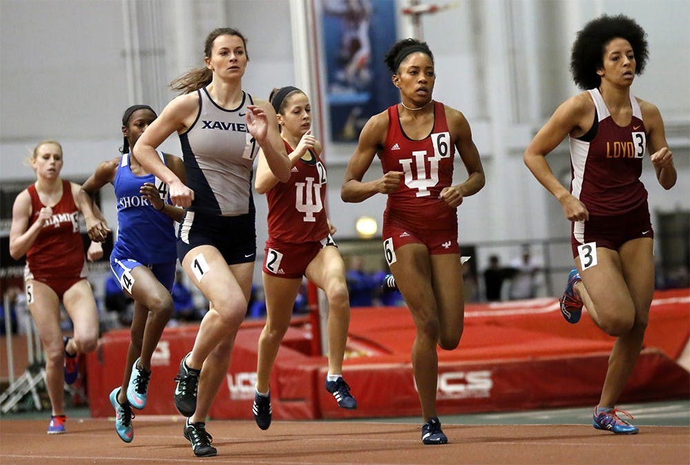 Taylor Williams, center number 6, competes in Women 600 Meter Run Saturday at Gladstein Fieldhouse. She finished the race as a first place. 
