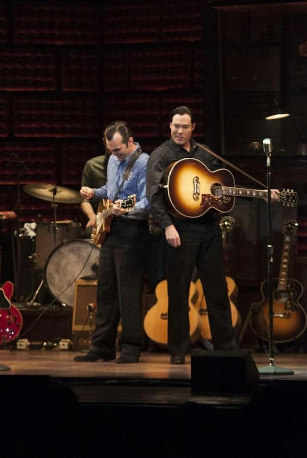 Carl Perkins, played by James Barry, and Johnny Cash, played by Scott Moreau, finish performing "Folsom Prison Blues" during the "Million Dollar Quartet" on Tuesday at the IU Auditorium.