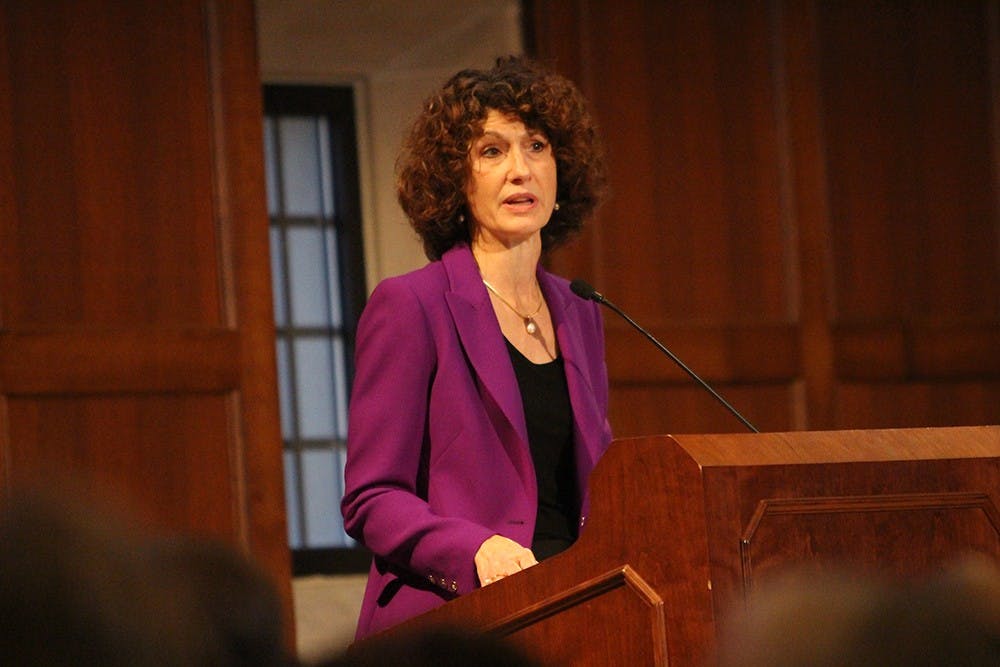 Laurie Burns McRobbie speaks during the "Night of Extraordinary Women" event hosted by My Sister's Closet on Thursday.  "In my life I've had extraordinary women to light my path," she said during her speech.