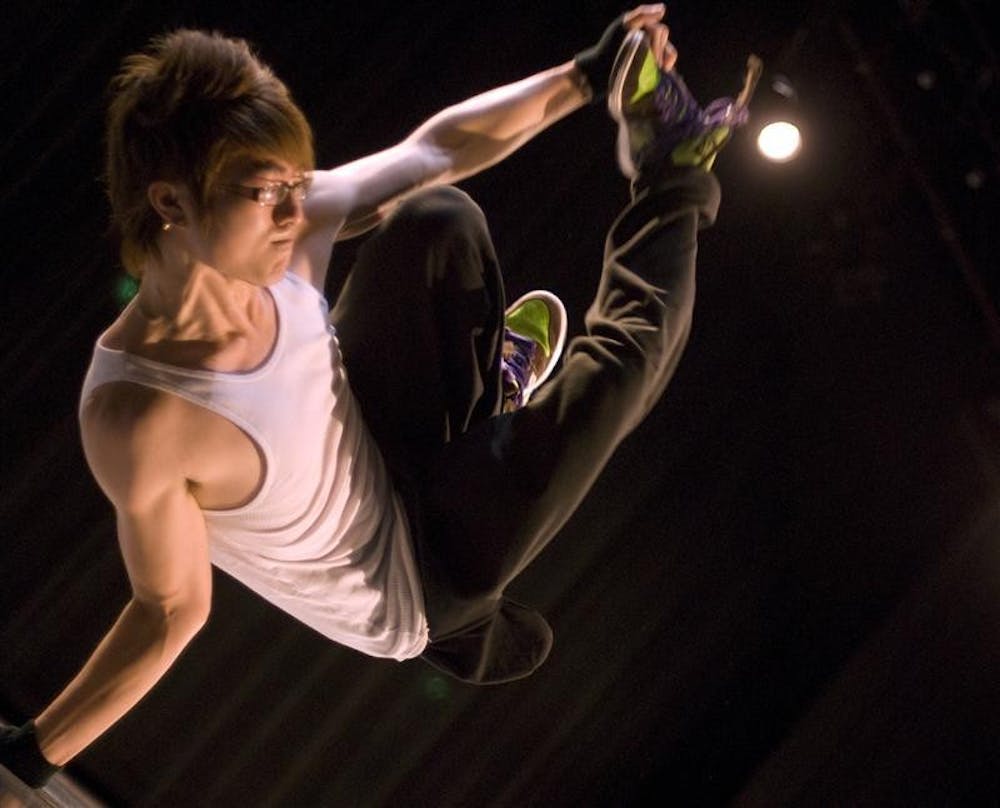 IU Bboy Chuck Li performs during the Asian American Association Fashion Show Friday night at the Willkie Auditorium. The free event included several performances and a runway fashion show finale by different Asian student organizations and individuals.