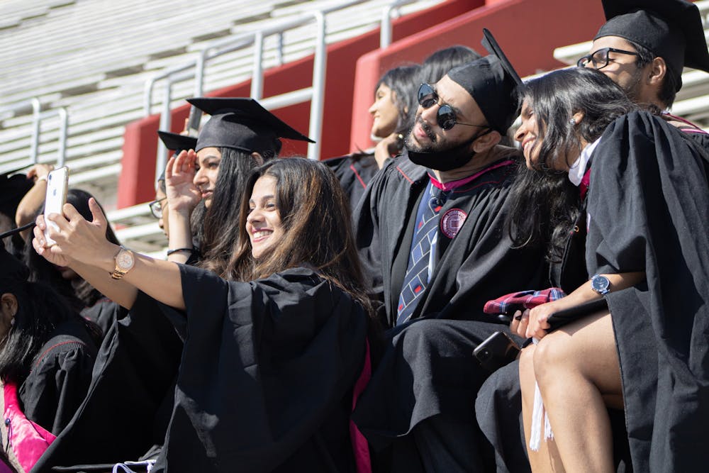 <p>Graduates of the Kelley School of Business Masters of Science in Information Systems program pose for a picture May 7, 2021, at Memorial Stadium. Keeping mental health in check after graduation can be challenging, but staying connected to friends and finding healthy coping mechanisms can help combat feelings of post-grad depression.</p>