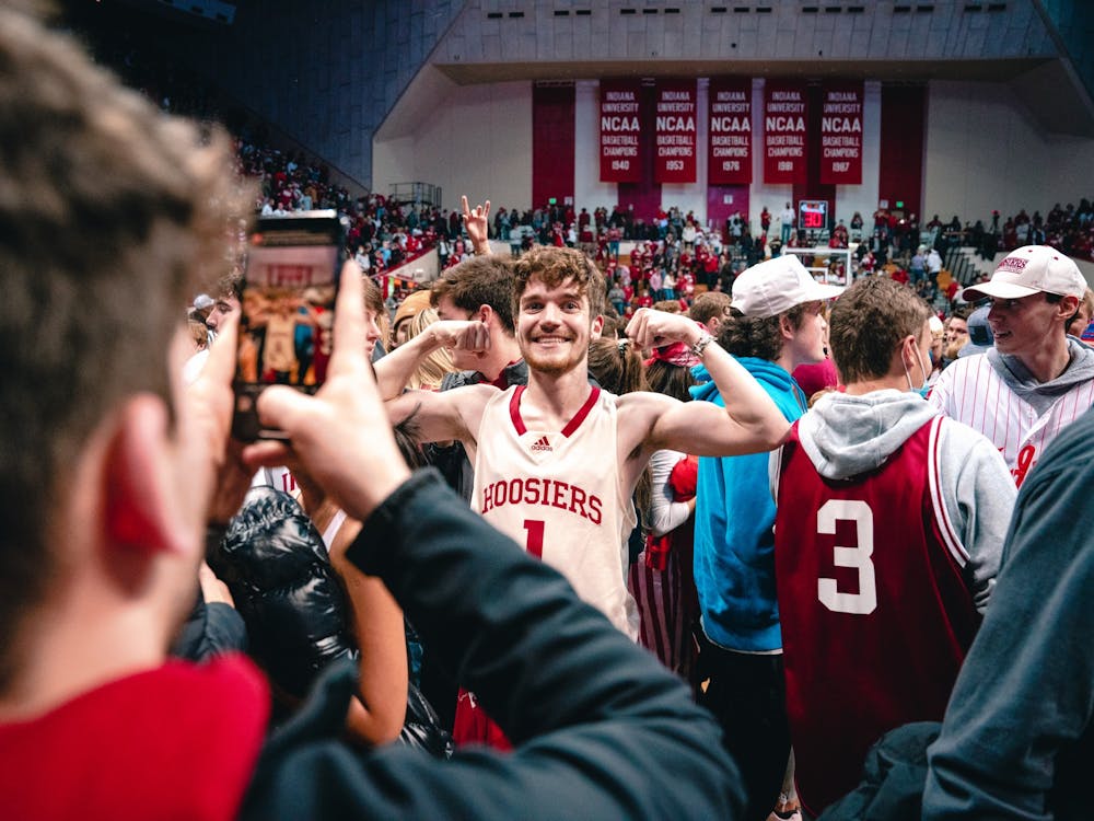 IU sophomore Ian Haithcoat poses for a photo while celebrating on the court after the upset win. Indiana’s overall record is 14-4 this season after defeating Purdue, with a 12-0 record at home.
