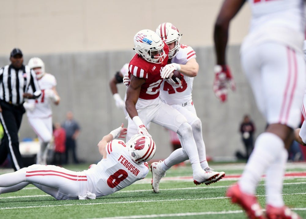 Sophomore wide receiver Whop Philyor carries the ball after a catch against Wisconsin on Nov. 14 at Memorial Stadium.&nbsp;