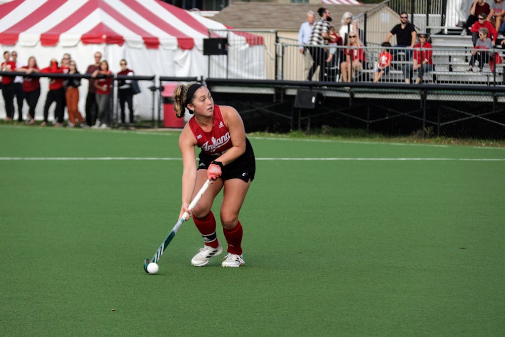 <p>Senior midfielder Jes McGivern looks down the field during a match against Michigan State University on Oct. 15, 2021, at the IU Field Hockey Complex. Indiana fell to No. 2 University of Michigan 5-3 Sunday.</p>
