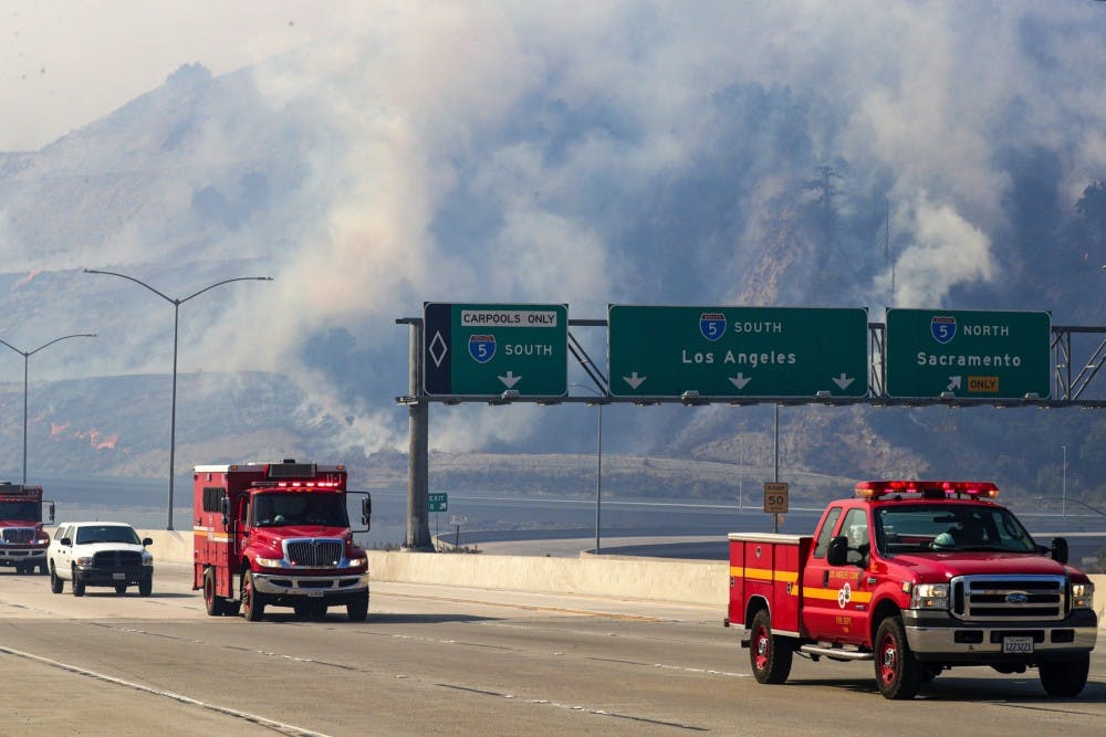 Freeway 5 and 14 are closed to traffic through Newhall Pass on Oct. 11 because of Saddle Ridge fire in Newhall, California. 