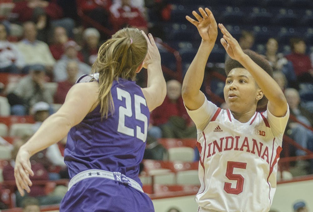 Sophomore guard Larryn Brooks attempts a three-point shot during the Hoosier’s game against Northwestern at Assembly Hall on Thursday. The Hoosiers had 20 turnovers and lost 75-69.