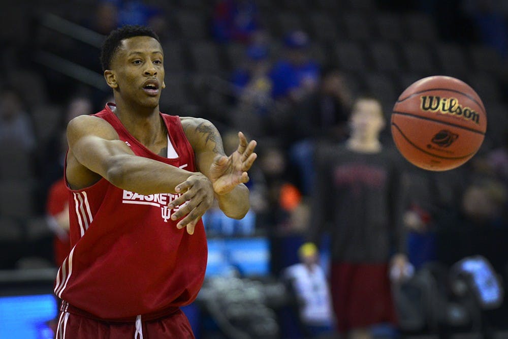 Sophomore forward Troy Williams passes the ball during practice Thursday at CenturyLink Center in Omaha, Neb.