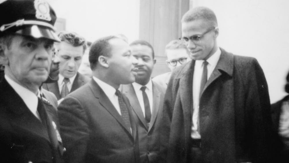 Malcolm X and Martin Luther King Jr. meet for the first and only time before a press conference March 26, 1964, at the U.S. Senate in Washington. 