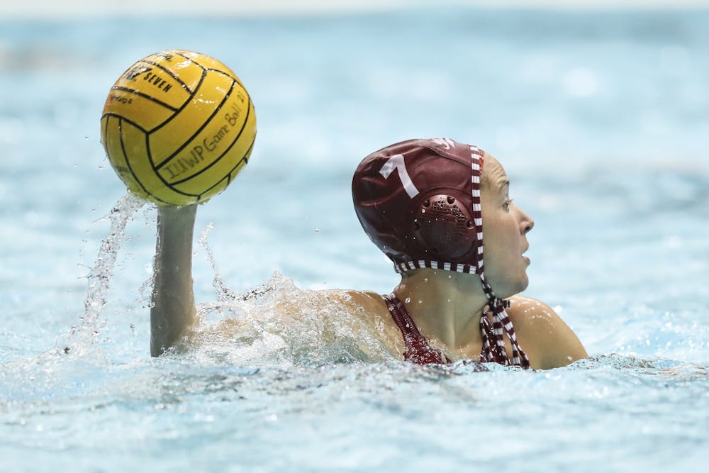 <p>Sophomore utility Katherine Hawkins looks to make a pass Jan. 25 at Counsilman-Billingsley Aquatics Center. IU hosted a doubleheader against Salem University, winning its first match 22-8 and its second match 19-3.</p>