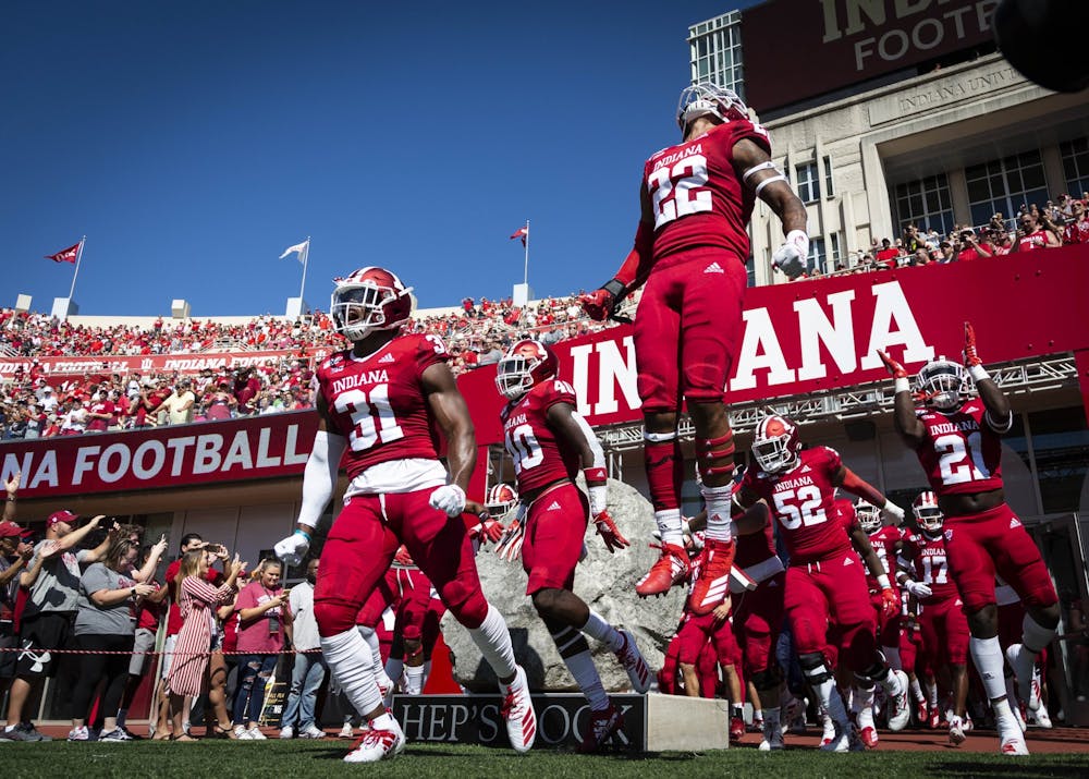 IU football players take the field at the start of a game at Memorial Stadium. The NCAA released new COVID-19 protocols for the fall 2021 season Wednesday.