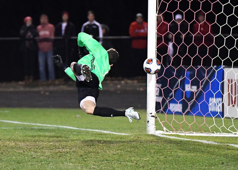Then-freshman, now sophomore goalkeeper Trey Muse deflects a penalty kick against Michigan State in the quarterfinals of the NCAA Tournament last season. Muse saved three shots against No. 18 UConn Sunday night in IU's 1-0 shutout.&nbsp;