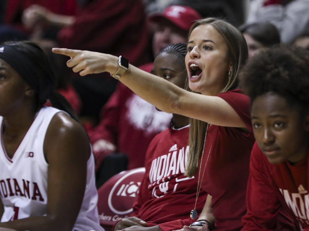 Then-women&#x27;s basketball graduate manager Ashley Williams yells Nov. 7, 2018, during a game against the University of Wisconsin – Milwaukee at Simon Skjodt Assembly Hall. Williams, the Hoosiers’ assistant coach in the 2020-21 and 2021-22 seasons and North Carolina State University alumna, accepted an assistant coaching position at NC State Wednesday night. 