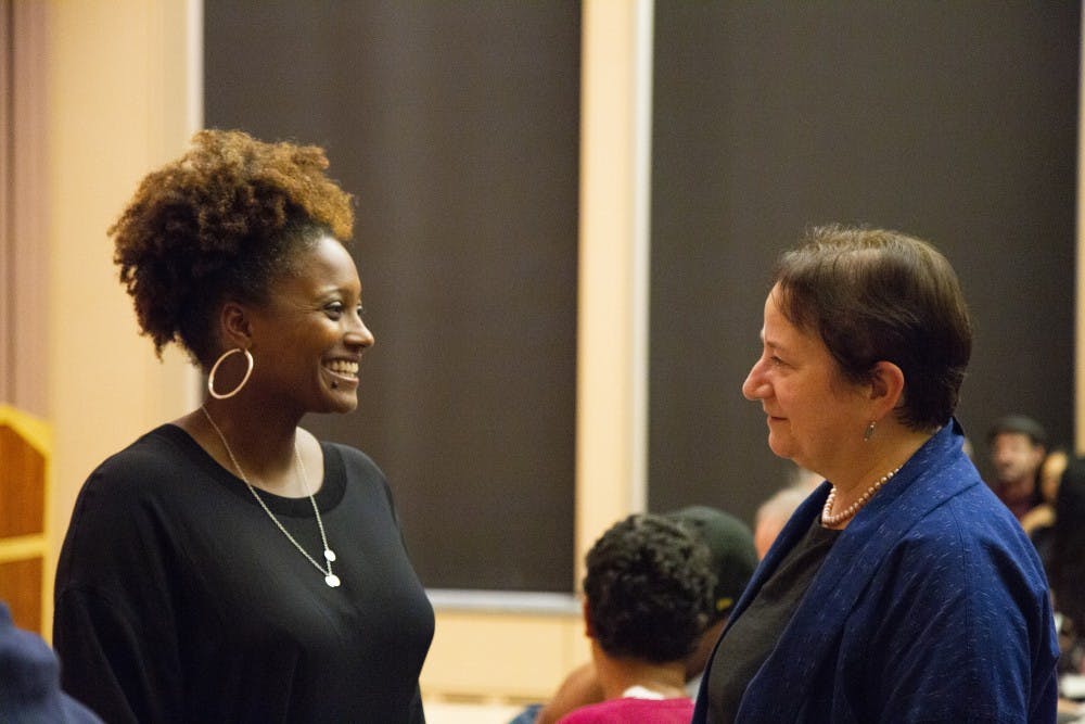 <p>Current United States Poet Laureate Tracy K. Smith, left, talks with IU Provost Lauren Robel, right, before the start of a poetry reading Thursday in the Neal-Marshall Black Culture Center. Smith, who is the 52nd U.S. poet laureate, won the Pulitzer Prize for Poetry in 2012.&nbsp;</p>