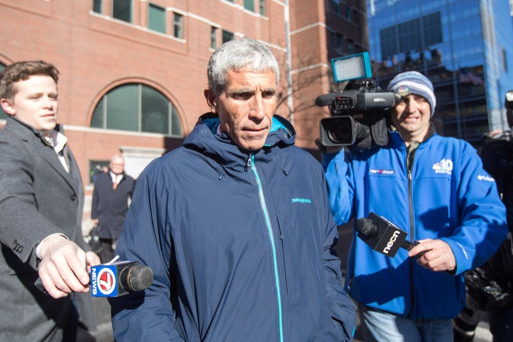 William &quot;Rick&quot; Singer leaves Boston Federal Court after being charged with racketeering conspiracy, money laundering conspiracy, conspiracy to defraud the United States and obstruction of justice March 12 in Boston. Singer is among several charged in an alleged college admissions scam.
